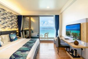 Letto o letti in una camera di Arena Beach Hotel