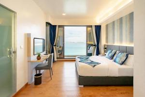 Letto o letti in una camera di Arena Beach Hotel