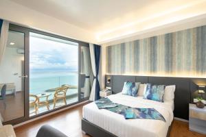Letto o letti in una camera di Arena Beach Hotel
