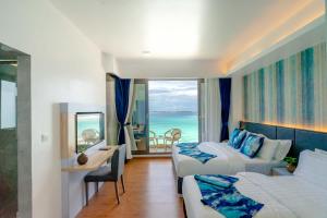 Letto o letti in una camera di Arena Beach Hotel