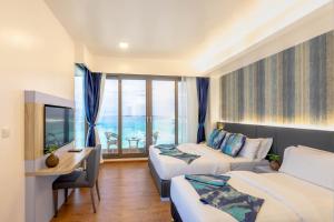 TV o dispositivi per l'intrattenimento presso Arena Beach Hotel