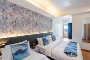 Letto o letti in una camera di Arena Beach Hotel