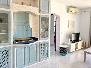 TV a/nebo společenská místnost v ubytování Apartamento playa 2 Fassers piscina Port Pollensa
