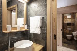 a bathroom with a sink and a mirror at Polaris 1 005 - LUXE & SKI LIFT apartment 6 pers in Zinal