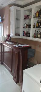 a kitchen with a wooden island in a room at HOTEL-LE-PARISIEN in Brazzaville
