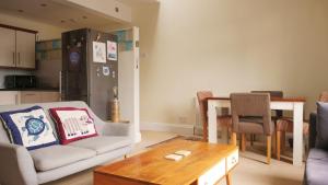 a living room with a couch and a table at Ebrington Street View in Plymouth