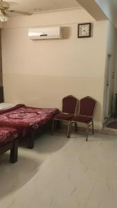 Area soggiorno di Raj Residency Mysuru