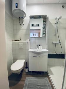 Ванна кімната в VISUM Apartments