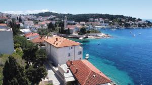 an aerial view of a town on the water at Gordana Apartments in Hvar