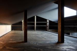 an empty room with a wooden floor and a window at YADORU KYOTO HANARE Washi No Yado in Kyoto