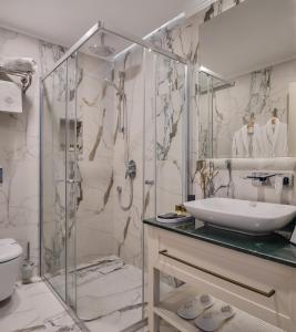 a bathroom with a shower and a sink at Delita City Hotel in Istanbul