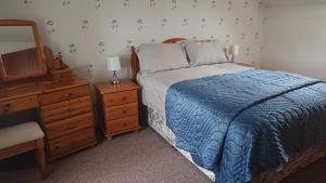 Voodi või voodid majutusasutuse The Cottage at Corvally toas