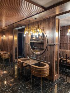 a dining room with a table and a mirror at Hotel Petra in Hrabušice +49 photos