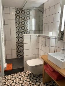 Koupelna v ubytování Hotel Au Cerf