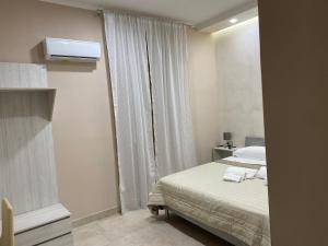 Łóżko lub łóżka w pokoju w obiekcie Hotel Poker