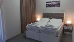 Letto o letti in una camera di Hotel Autograph