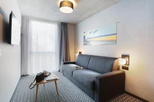 Appart Hotel Odalys City Toulouse Blagnac Aéroport的休息区