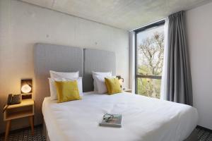 Appart Hotel Odalys City Toulouse Blagnac Aéroport客房内的一张或多张床位
