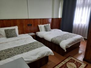 Postel nebo postele na pokoji v ubytování Kanari B&B