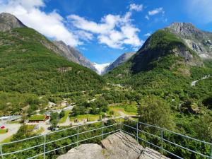 a view of the mountains from the top of a tower at Melkevoll Bretun Camping in Stryn