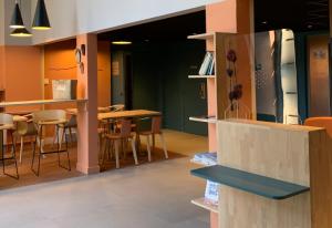 a dining room with a table and chairs at City Résidence Aix-en-Provence in Aix-en-Provence