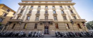 a group of motorcycles parked in front of a building at Astrid Hotel in Florence