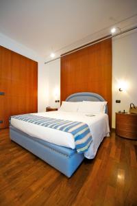 Postel nebo postele na pokoji v ubytování Hotel Royal Torino Centro Congressi