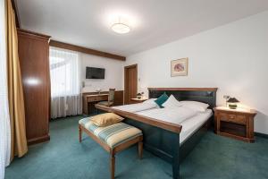Postel nebo postele na pokoji v ubytování Hotel Weisse Lilie - B&B