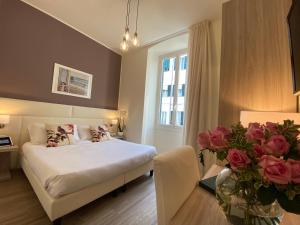 Postel nebo postele na pokoji v ubytování Hotel Eletto