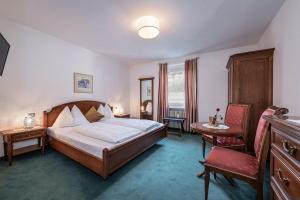 Postel nebo postele na pokoji v ubytování Hotel Weisse Lilie - B&B