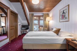 Postel nebo postele na pokoji v ubytování Hotel Weisse Lilie - B&B