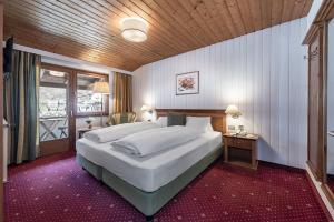 Postel nebo postele na pokoji v ubytování Hotel Weisse Lilie - B&B