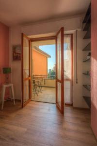 an open door to a room with a balcony at La Casa di Cheyenne - SEA VIEW 011019-LT-0221 in Monterosso al Mare