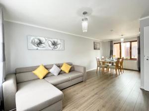 a living room with a couch and a table at Comfy 3-Bedroom House in Worksop in Worksop