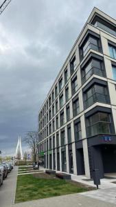 a large building on the side of a street at Apartament Powiśle Deluxe in Warsaw