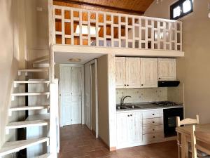 a kitchen with a loft bed in a kitchen at Ai house boutique in Castel di Sangro