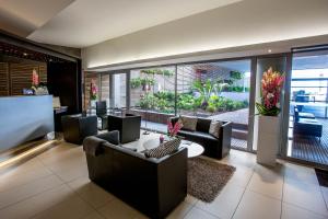 a living room with couches and a table at Royal Antibes - Luxury Hotel, Résidence, Beach & Spa in Antibes