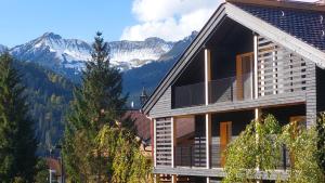 a house with a mountain in the background at Kranzmuehle - Ankommen am Achensee in Achenkirch