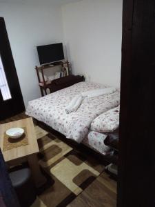 Ein Bett oder Betten in einem Zimmer der Unterkunft Apartman Jovanovic-Rudnik