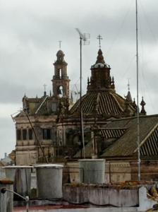 an old building with a clock tower in the background at Fernan Caballero in Carmona