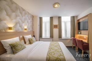 Postel nebo postele na pokoji v ubytování Hotel Fevery