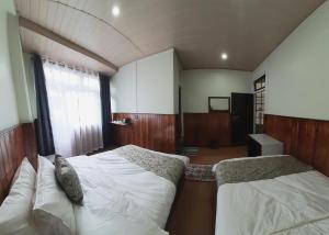 Postel nebo postele na pokoji v ubytování Kanari B&B