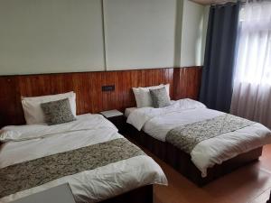Postel nebo postele na pokoji v ubytování Kanari B&B