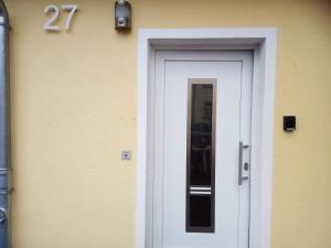 a door to a house with the number on it at Kleines Nest in Radebeul