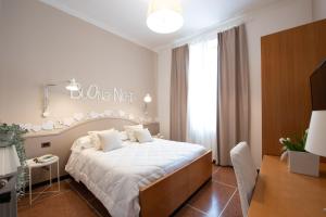 Voodi või voodid majutusasutuse Hotel Tigullio toas