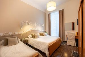 Voodi või voodid majutusasutuse Hotel Tigullio toas