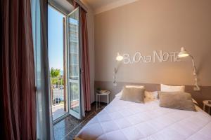 Voodi või voodid majutusasutuse Hotel Tigullio toas