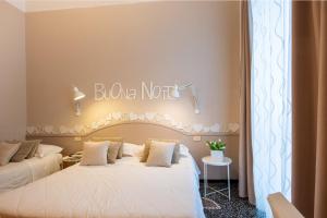 Voodi või voodid majutusasutuse Hotel Tigullio toas