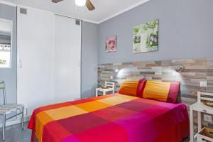 Postel nebo postele na pokoji v ubytování Rainbow Amadores
