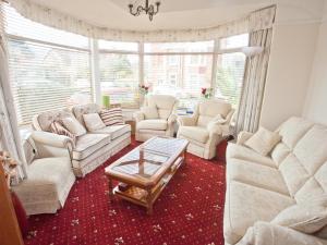 a living room with two couches and a coffee table at The Clydesdale in Paignton